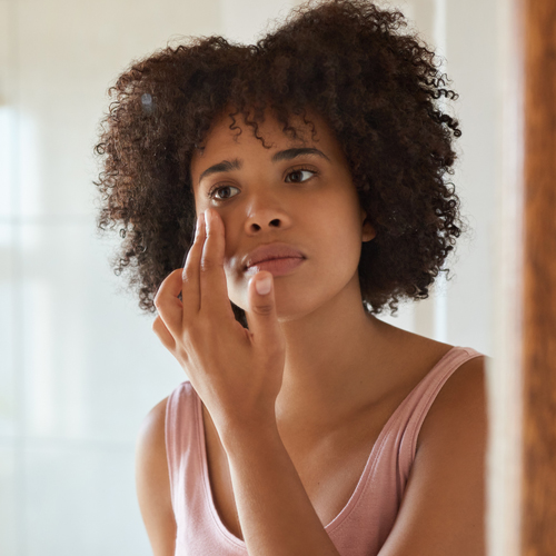 Woman checking her face